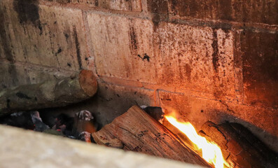 Starting the fire to roast the barbecue.