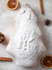 Christmas concept card. Homemade baking, Christmas tree-shaped biscuits on a stone table. Top view, flat lay.
