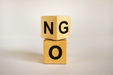 Fliped cube, changes the word NO to GO. Beautiful white background. Copy space. Business and motivational concept.