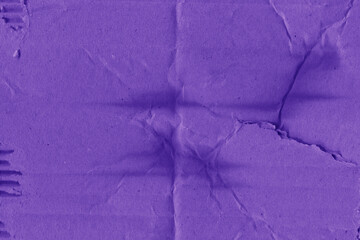 Obraz premium A violet vintage rough sheet of carton. Recycled environmentally friendly cardboard paper texture. Simple minimalist papercraft background.