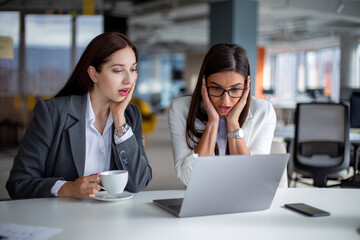 Two young colleagues get surprising news at work.