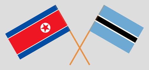 Crossed flags of Botswana and North Korea