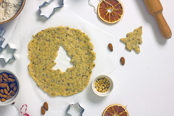Gluten Free Christmas Cookies. Making homemade Christmas tree gluten-free cookies. Rolled dough and cutting molds, top view, flat lay, copy space