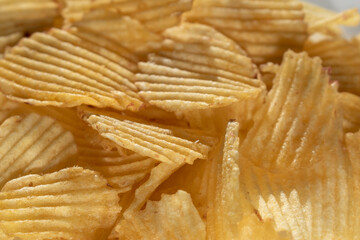 potato chips scattering ,close up shot for textures or background