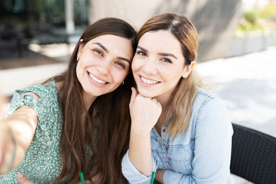 Portrait of happy lesbian couple during a date