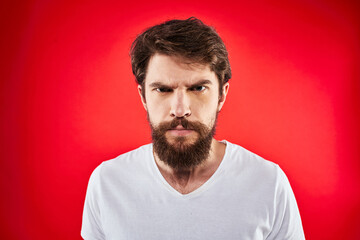 Fototapeta premium man in t-shirt gesturing with his hands dissatisfaction studio red uniform