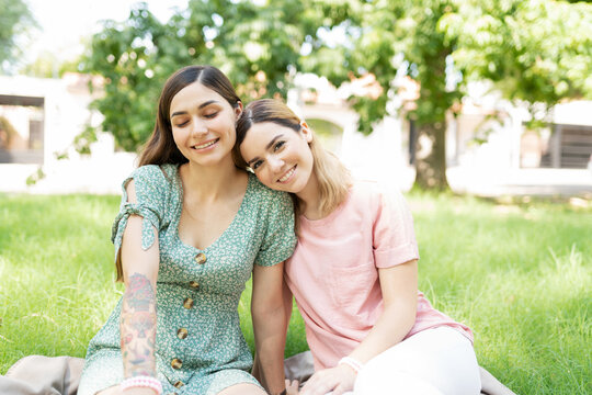 Happy lesbian couple on a date in the park