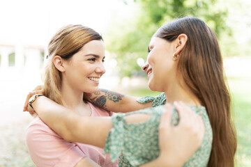 Lesbian young couple hugging and making eye contact