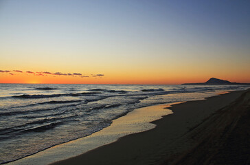 A golden sunrise on the beach, Mediterranean sea