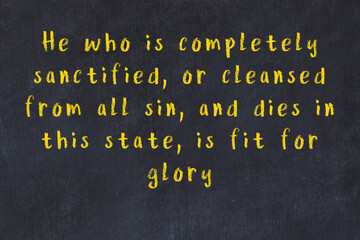 Chalk wise inscription on black chalkboard