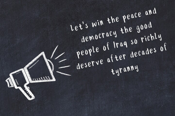 Chalk sketch of loudspeaker on black desk and movitational quote