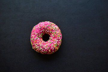 American delicious donuts on a black background