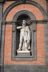 Fototapeta na wymiar King Alfonso V of Aragon statue on the facade of the Royal Palace, Piazza del Plebiscito, Naples, Campania, Italy