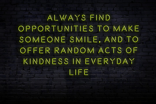 Wise quote. Neon inscription against brick wall