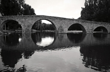 Old stone bridge over river, Spain