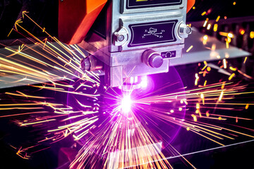 Laser cutting of metal. Close-up. Sparks fly