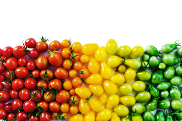 The harvest of tomatoes. Different color and varieties of tomatoes on a white background. Healthy and natural food. 