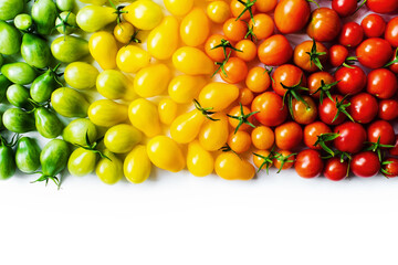 The harvest of tomatoes. Different color and varieties of tomatoes on a white background. Healthy and natural food. Vertical