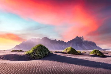 Fototapete Rund Gorgeous landscape with black sand desert dunes and grassy bumps near famous Stokksnes mountains on Vestrahorn cape, Iceland © Ivan Kmit