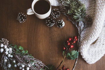 Christmas wooden background with branches of Christmas tree and Christmas decorations with snow. Christmas design. Copy space