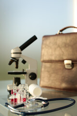 Stethoscope ampoule pill microscope briefcase.on glass table