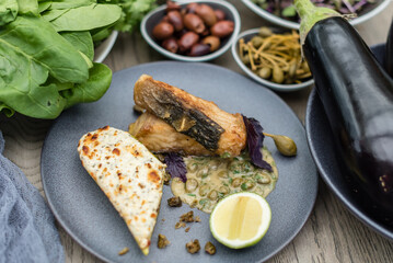 Fried Sturgeon Fish with Cheesy Baked Courgette and Caper Sauce