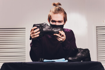boots. applying cream with your finger. Shoe repair.