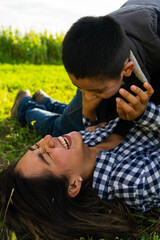 Latin woman smiling while her son is on her
