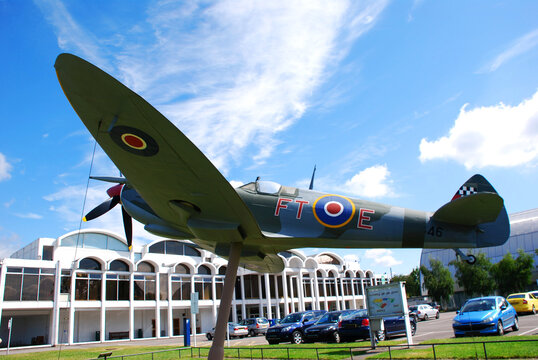 
Royal Air Force (RAF) Museum / Hendon, London, UK - June 29, 2014: A Supermarine Spitfire fighter on display outside the entrance of the RAF museum 