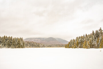 frozen lake with mountains