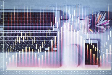 Multi exposure of forex graph drawing over desktop background with computer. Concept of financial analysis. Top view.