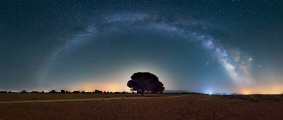 Panoramic photo with Milky Way arch