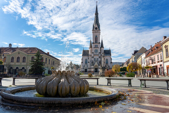 Old main town square with fountains and sacred heart church Kőszeg, Hungary