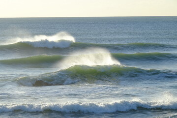 Some big waves breaking in a sunny day during a perfect day at la govelle, a surf spot located in the west of France.