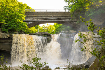 Water cascades under a bridge in Ohio