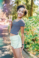 Happy, smiling, teen girl sticking tongue out 