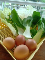 fresh vegetables and egg in a basket