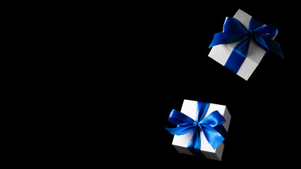 Online shopping gifts. White gifts with blue bow falling on black background for Black Friday banner. Copy space. Flying backdrop.