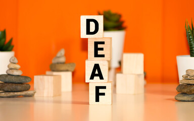 DEAF word made with building blocks isolated on white