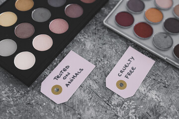 cruelty free vs animal tested cosmetics eyeshadow palettes with text on labels
