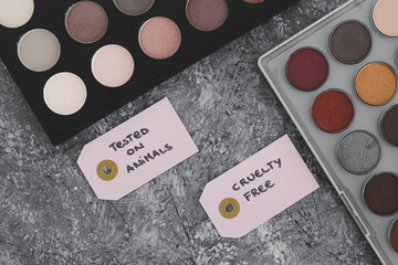 cruelty free vs animal tested cosmetics eyeshadow palettes with text on labels