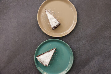 Chocolate Cake Slice Brownie on Colored Plate Dark Stone Table Top View Flat Lay 
