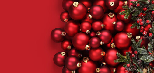 Christmas decorations, top view of pile of glass balls colored in red and mistletoe, isolated on...