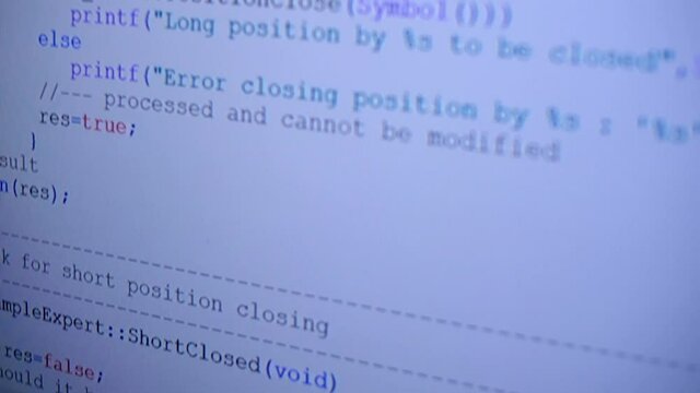 Lines of programmes code run across the white screen. Hacker tries to break security and commit data theft. Closeup