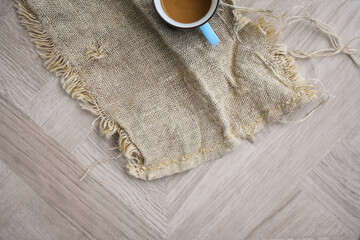 Coffee Cup on Linen Material Beautiful Design Wooden Table Top View
