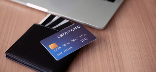 Credit Card on top Desk with wallet and laptop, online shopping, shopping online, payment online, order online.