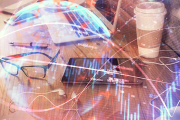 Naklejka premium Double exposure of forex chart drawing and cell phone background. Concept of financial trading
