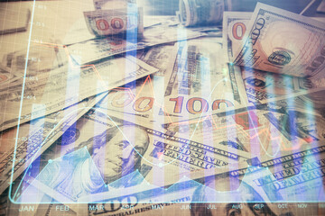 Multi exposure of forex chart drawing over us dollars bill background. Concept of financial success markets.