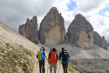 group of hikers on the trail in Dolomites