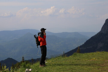 Man talking on phone in mountain
